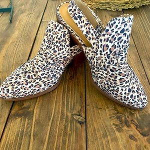 Animal printed booties with an open heel. Never worn!